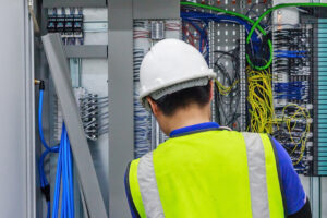 Technician at an Automation Panel